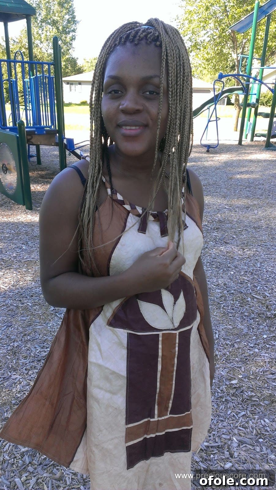 A joyful image of a pregnant woman, possibly in her second trimester.