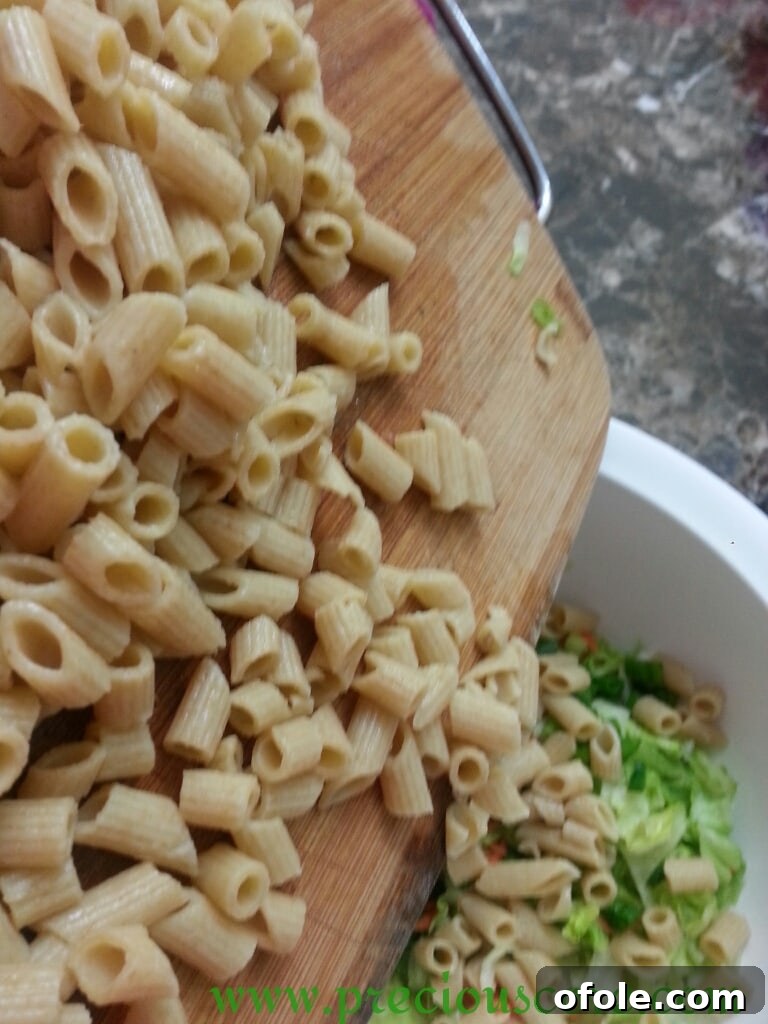 All chopped salad ingredients combined in a large mixing bowl