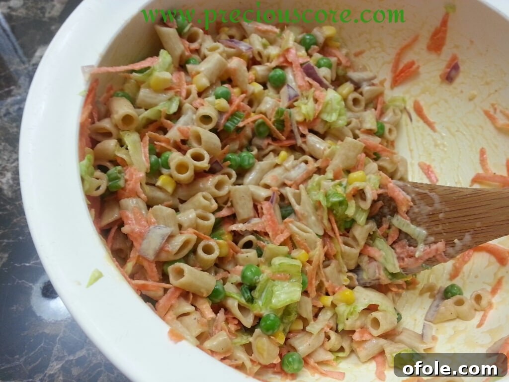 Healthy pasta salad with dressing mixed in, ready to serve