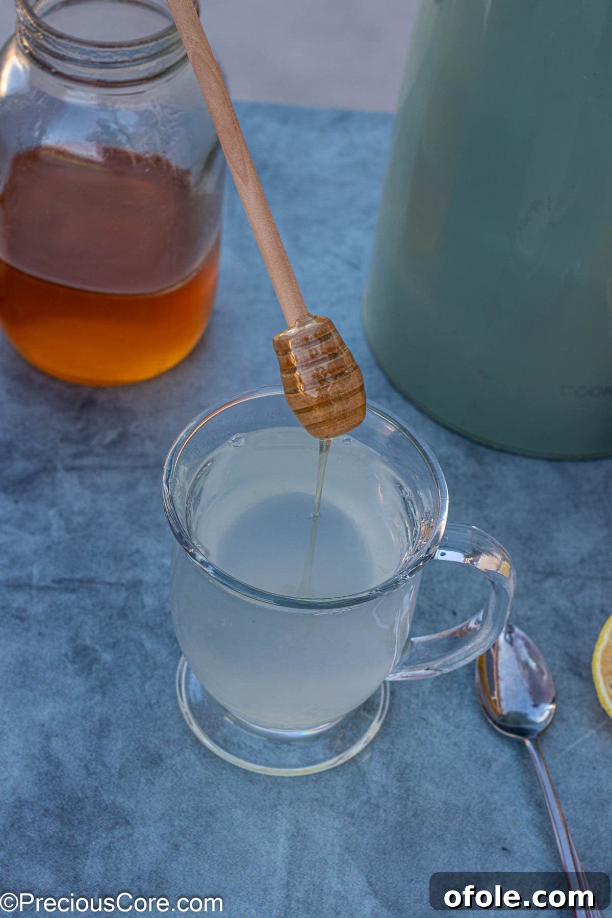 Sweet Citrus Soother 7 Adding honey to lemon tea.