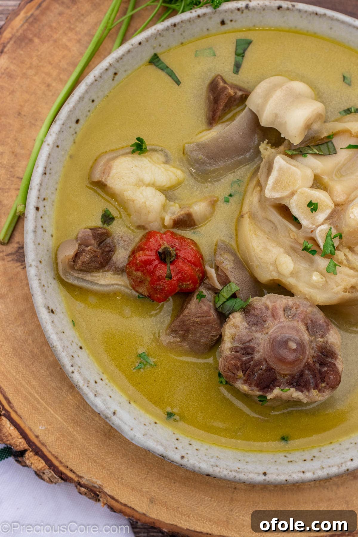 Authentic Cameroonian Pepper Soup 3 Closer shot of pepper soup with meats in a bowl.