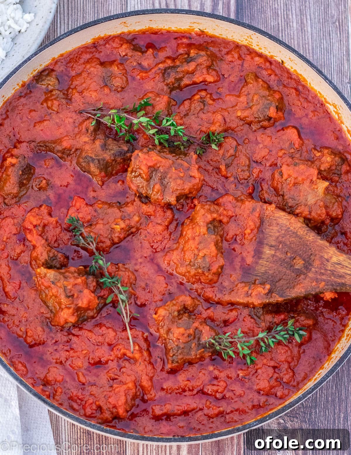 Soulful Nigerian Beef Stew 12 A shallow pot of Nigerian Beef Stew, showcasing its rich texture and appetizing color.