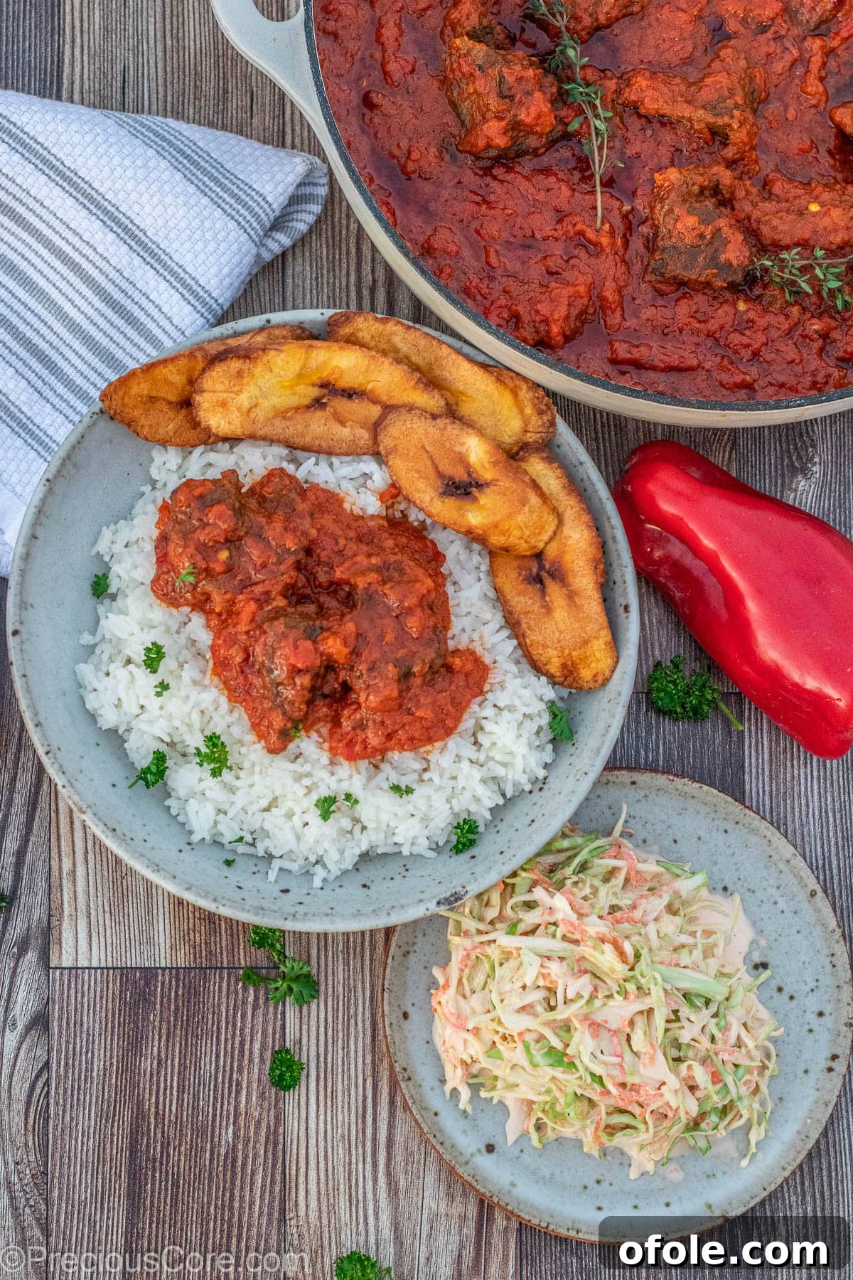 Soulful Nigerian Beef Stew 10 Nigerian beef stew served with a portion of rice, sweet fried plantains, and coleslaw for a complete meal.