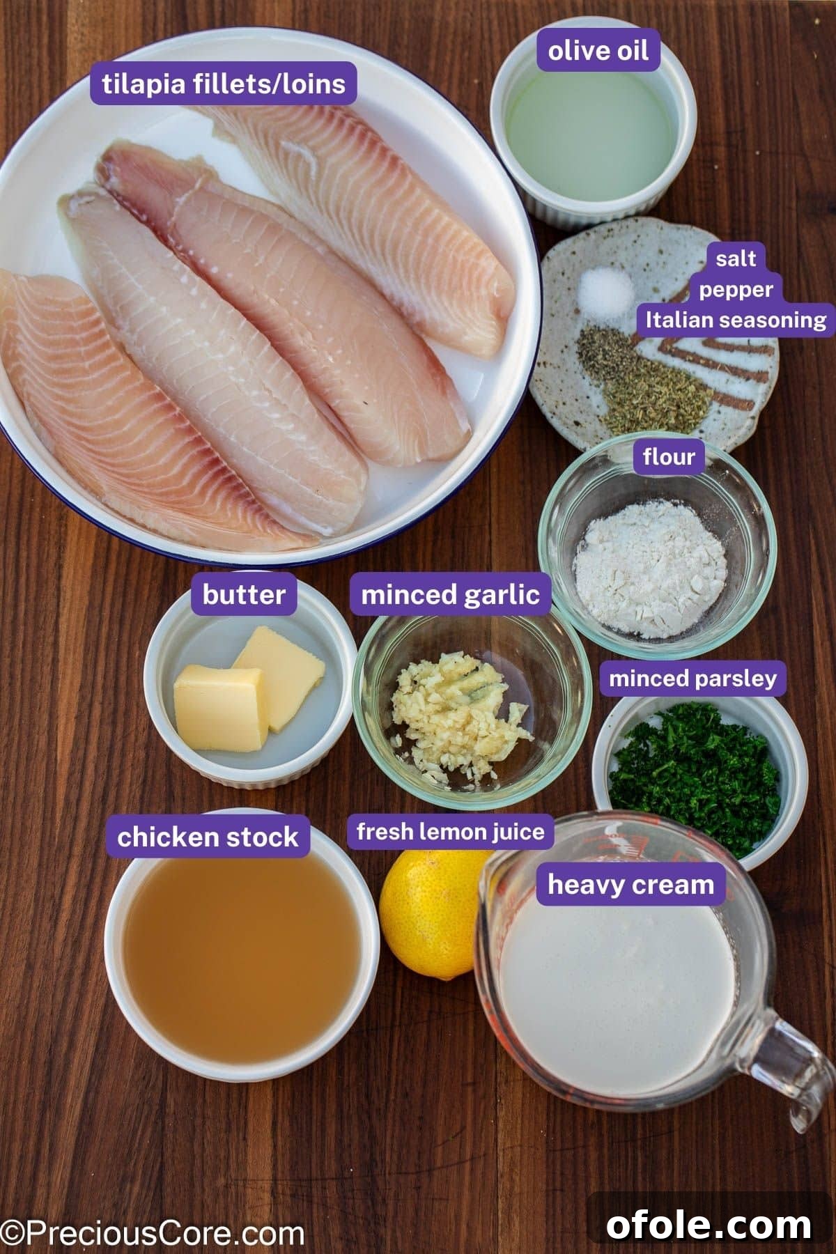 Velvety White Fish 4 Carefully measured ingredients laid out for the Fish in White Sauce recipe, including fresh tilapia fillets, lemons, garlic, butter, and heavy cream.