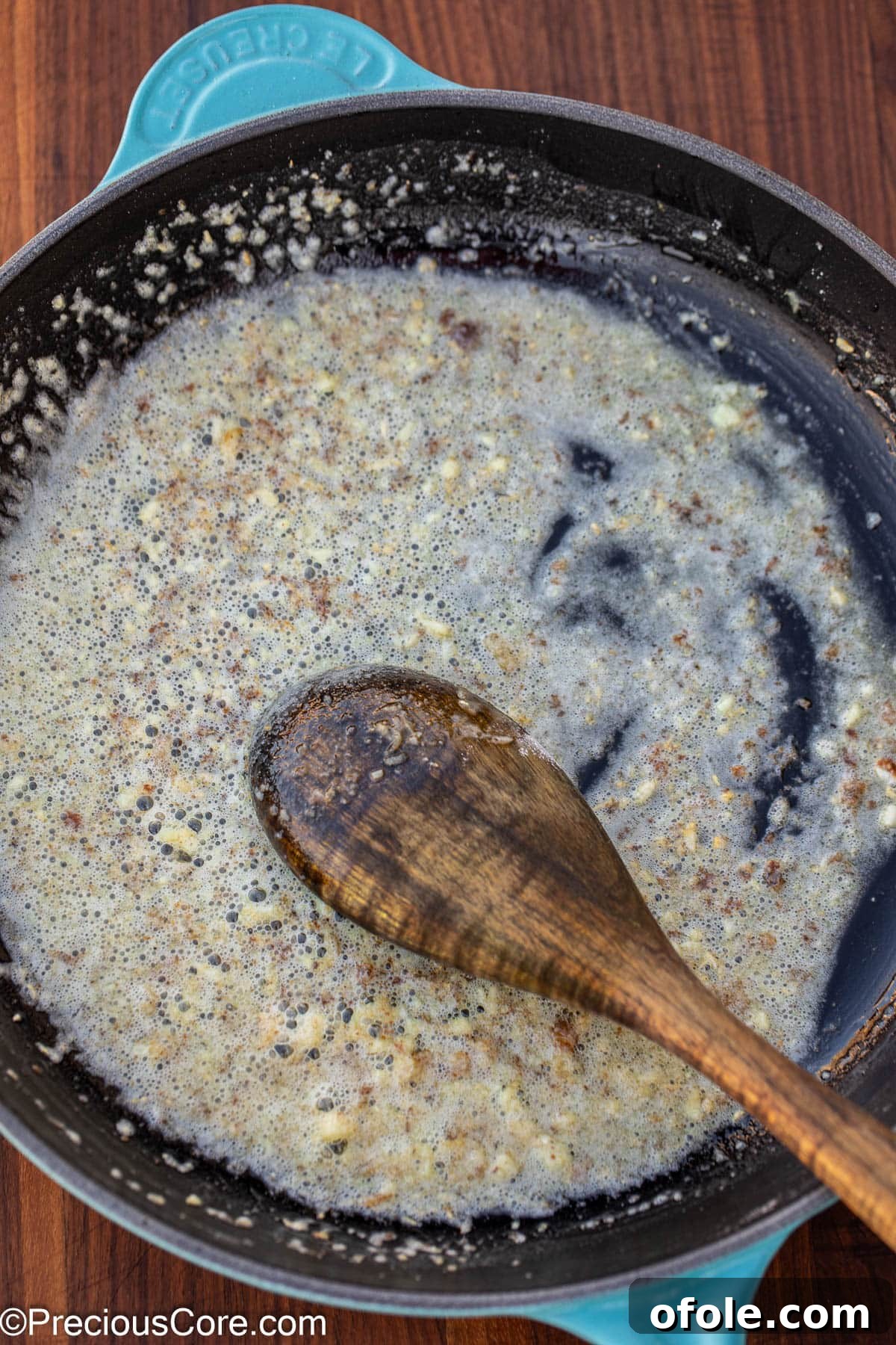 Velvety White Fish 7 Melted butter and minced garlic simmering in the skillet, forming the aromatic base for the white sauce.