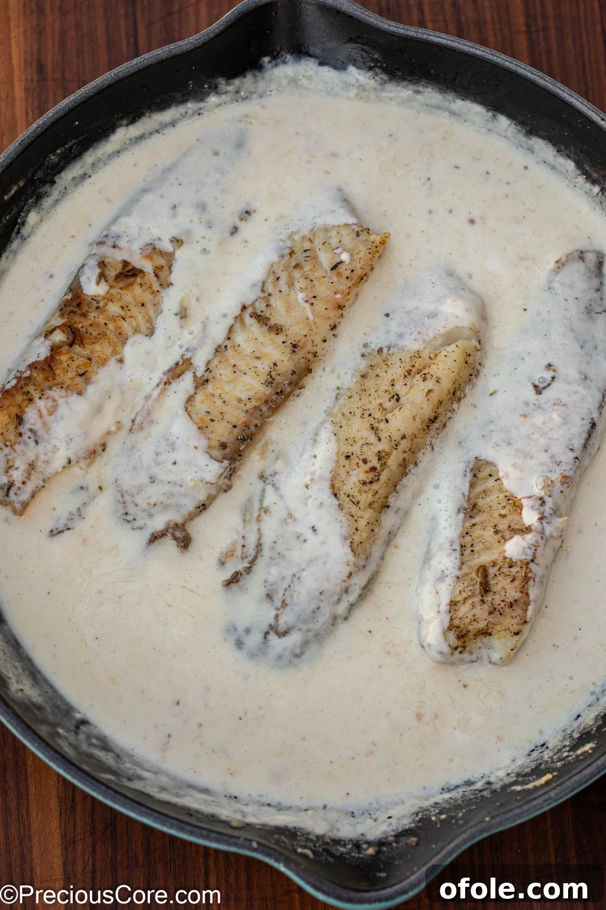 Velvety White Fish 10 Fish fillets gently poaching in the creamy white sauce, absorbing all the delicious flavors.