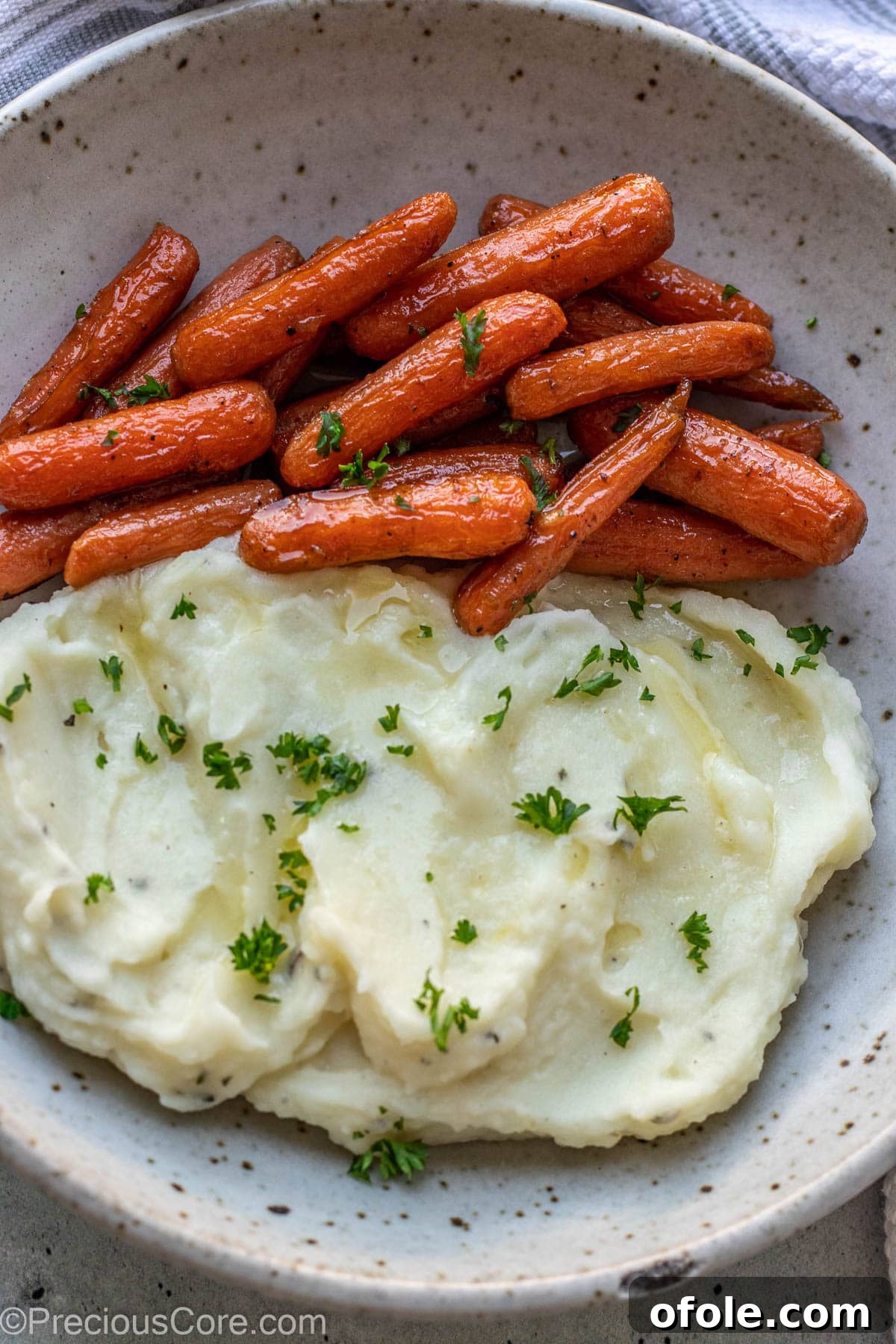 Aromatic Rosemary Garlic Mash 3 Mashed potatoes and carrots in a bowl.