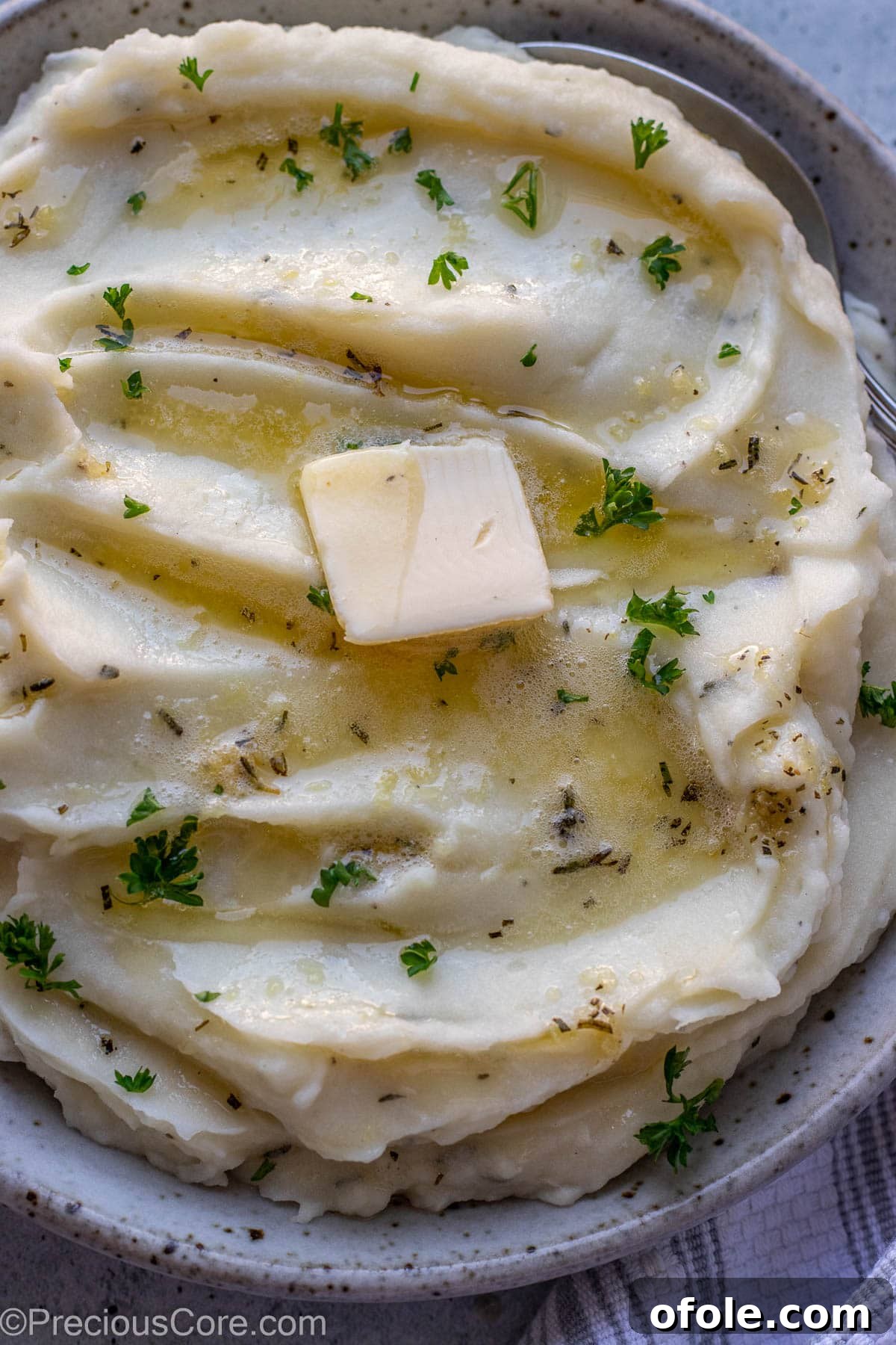 Aromatic Rosemary Garlic Mash 9 Close up shot of mashed potatoes in a bowl.
