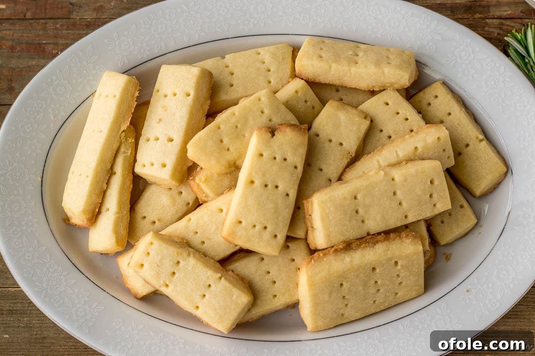 Perfect Buttery Shortbread From Scratch 17 A large serving tray filled with beautifully arranged homemade shortbread cookies, perfect for sharing.