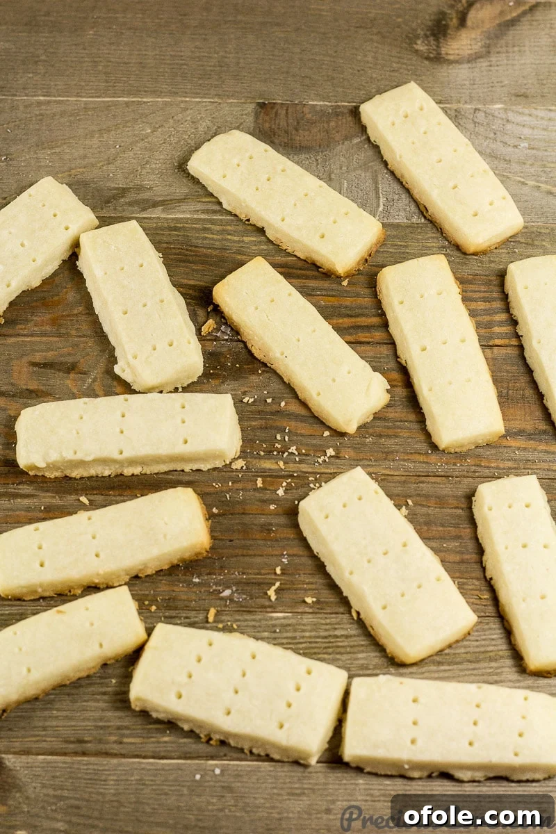 Perfect Buttery Shortbread From Scratch 3 A close-up shot of perfectly baked homemade shortbread cookies, showcasing their golden edges and delicate texture.
