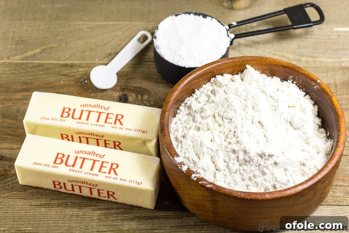 Perfect Buttery Shortbread From Scratch 5 The three simple ingredients for homemade shortbread cookies: butter, icing sugar, and plain flour, neatly laid out.