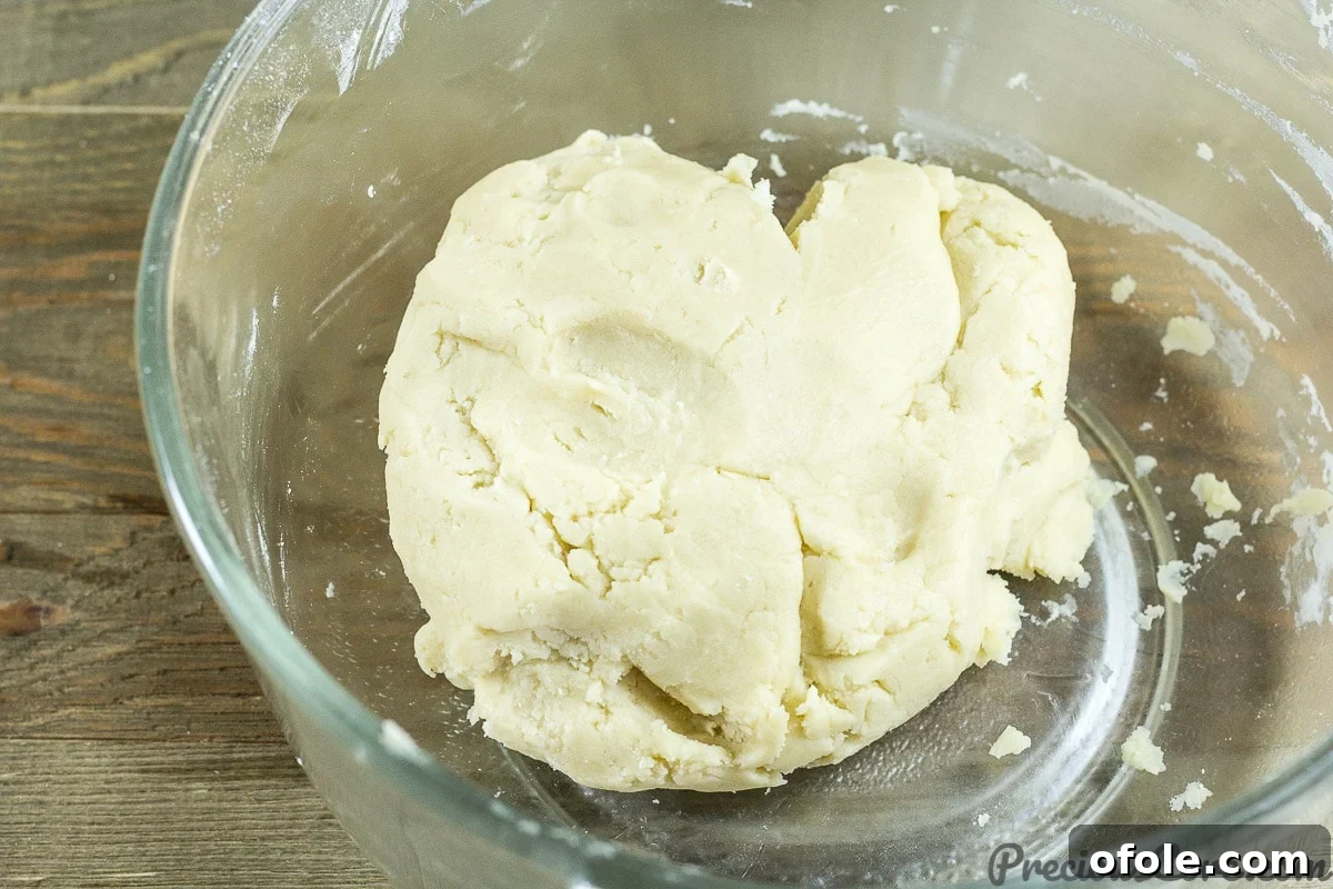 Perfect Buttery Shortbread From Scratch 10 The homemade shortbread cookie dough neatly formed into a smooth, round ball, ready for chilling.