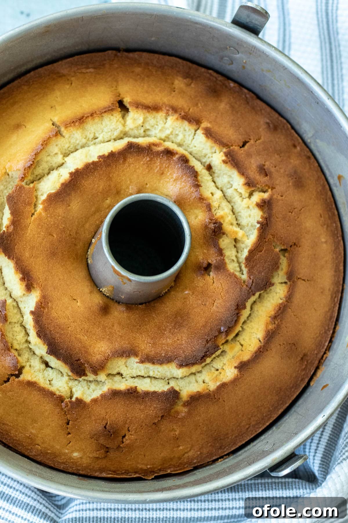 A beautifully baked Pineapple Upside Down Pound Cake still in its baking dish, cooling down.