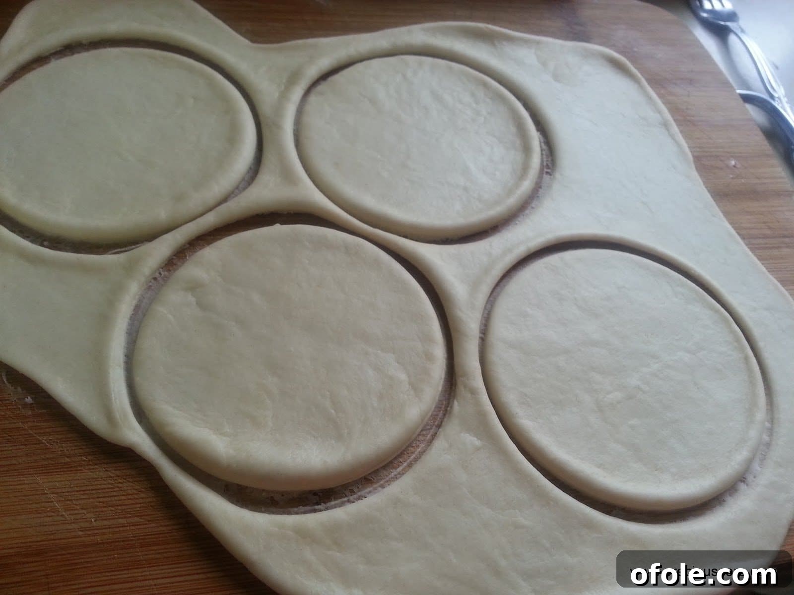 Filling being placed onto dough circles