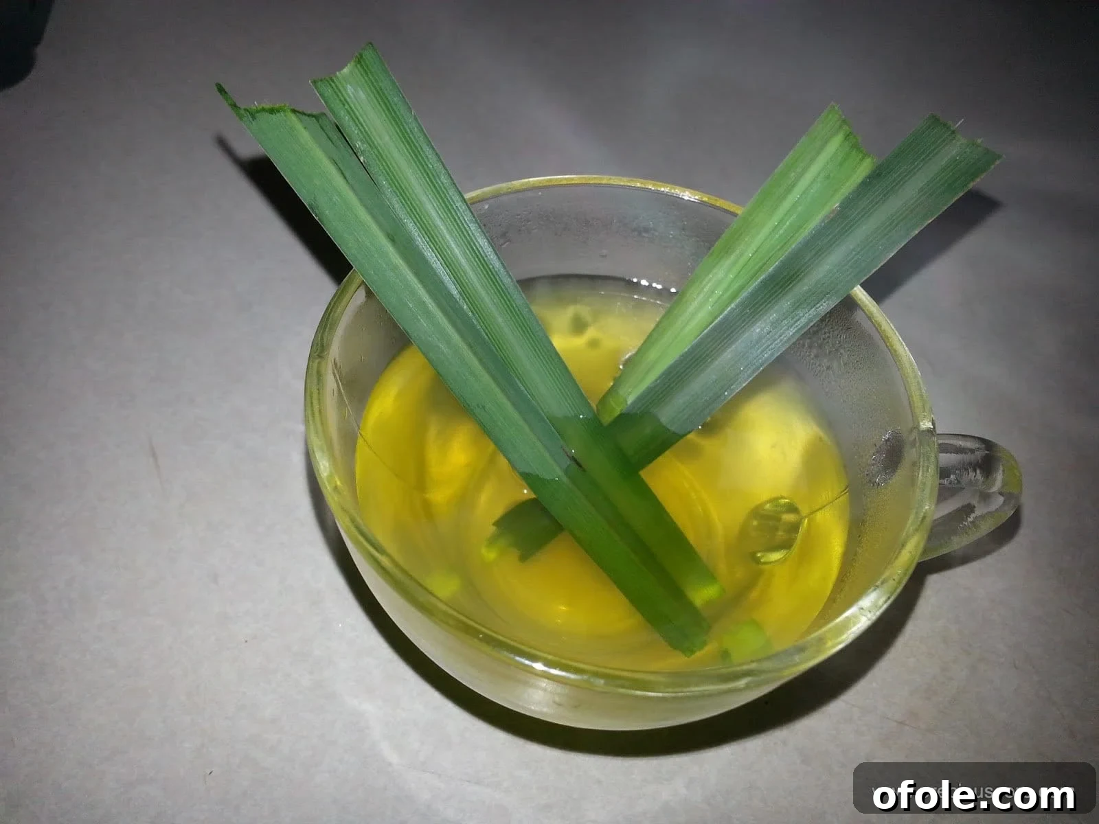 A steaming cup of fresh lemongrass tea, inviting and aromatic.
