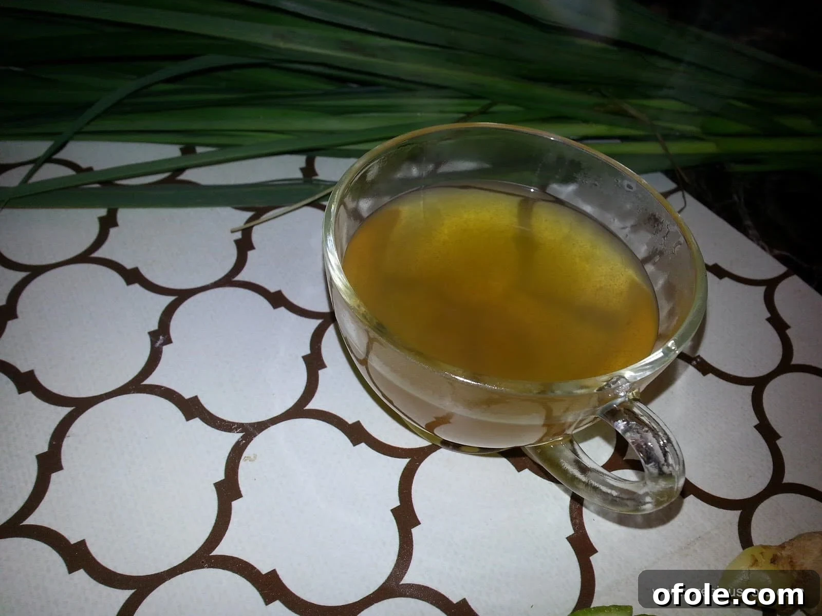 A close-up of lemongrass stalks in a bowl, ready for cooking or brewing.