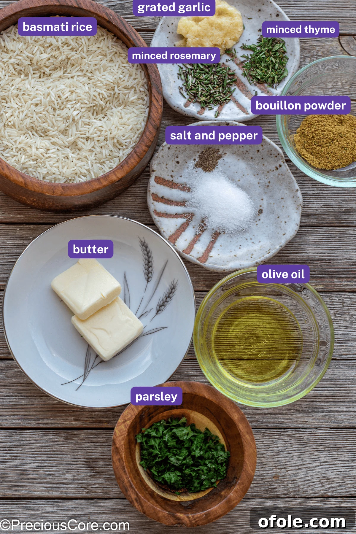 Prepped ingredients for garlic herb rice with labels for each item, including olive oil, garlic, fresh rosemary, thyme, and spices, laid out on a cutting board.