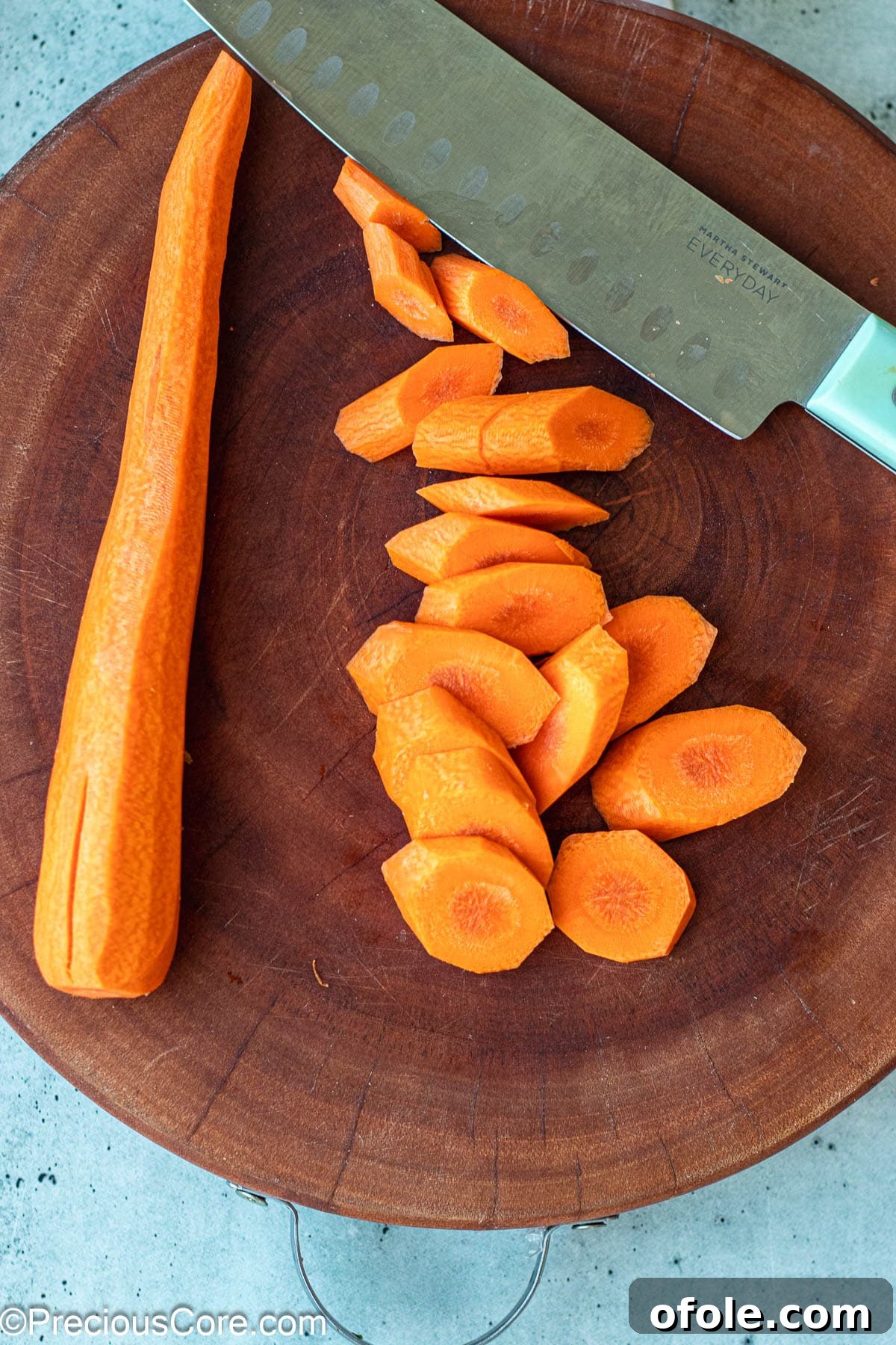 Caramelized Carrots 4 Diagonally cut carrots on a chopping board.