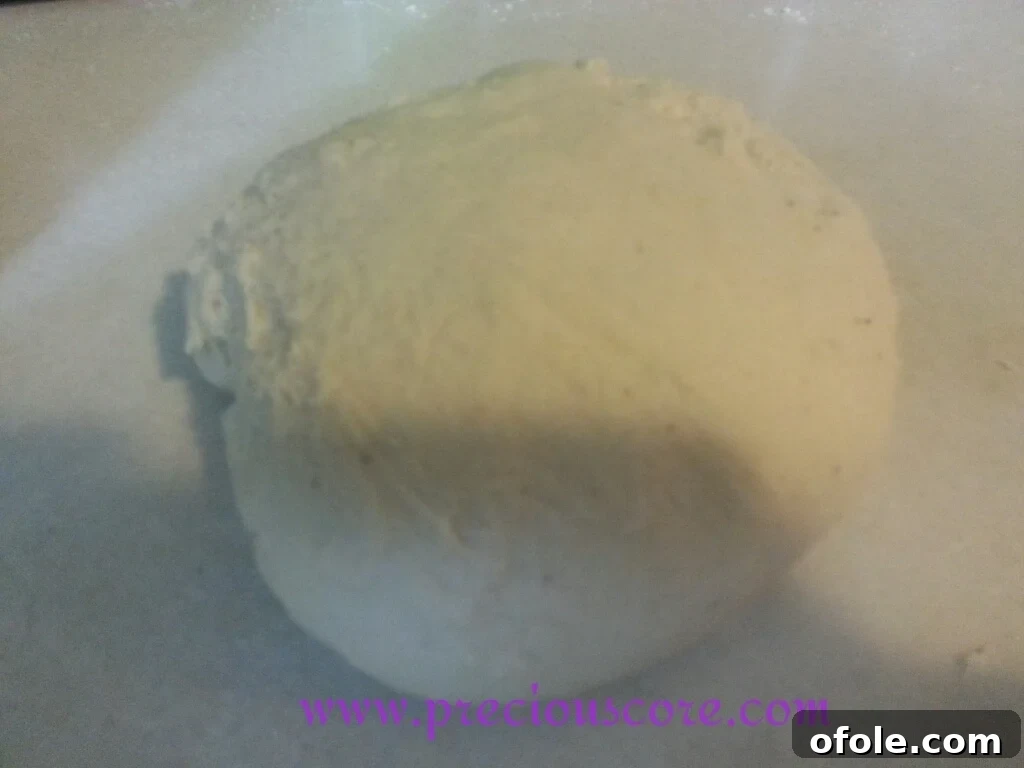 Preparing Bowl for Dough Rise Vegetable oil poured into a clean mixing bowl