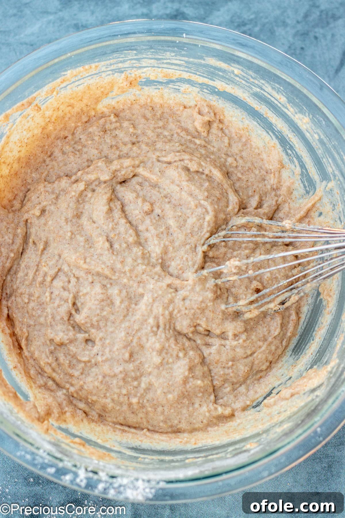 Wet and dry ingredients for muffins lightly whisked together to form a batter.