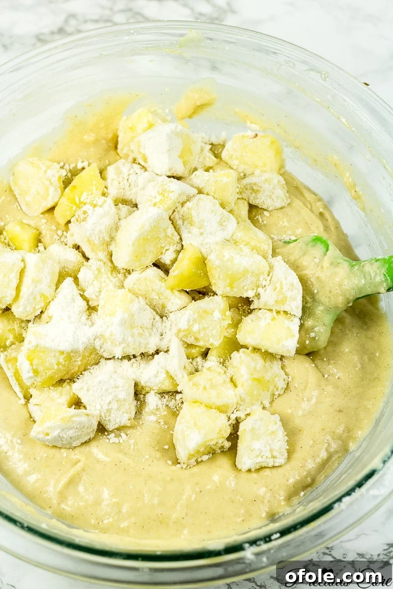 Timeless Fresh Apple Cake 11 Chopped apple chunks gently folded into the prepared cake batter.