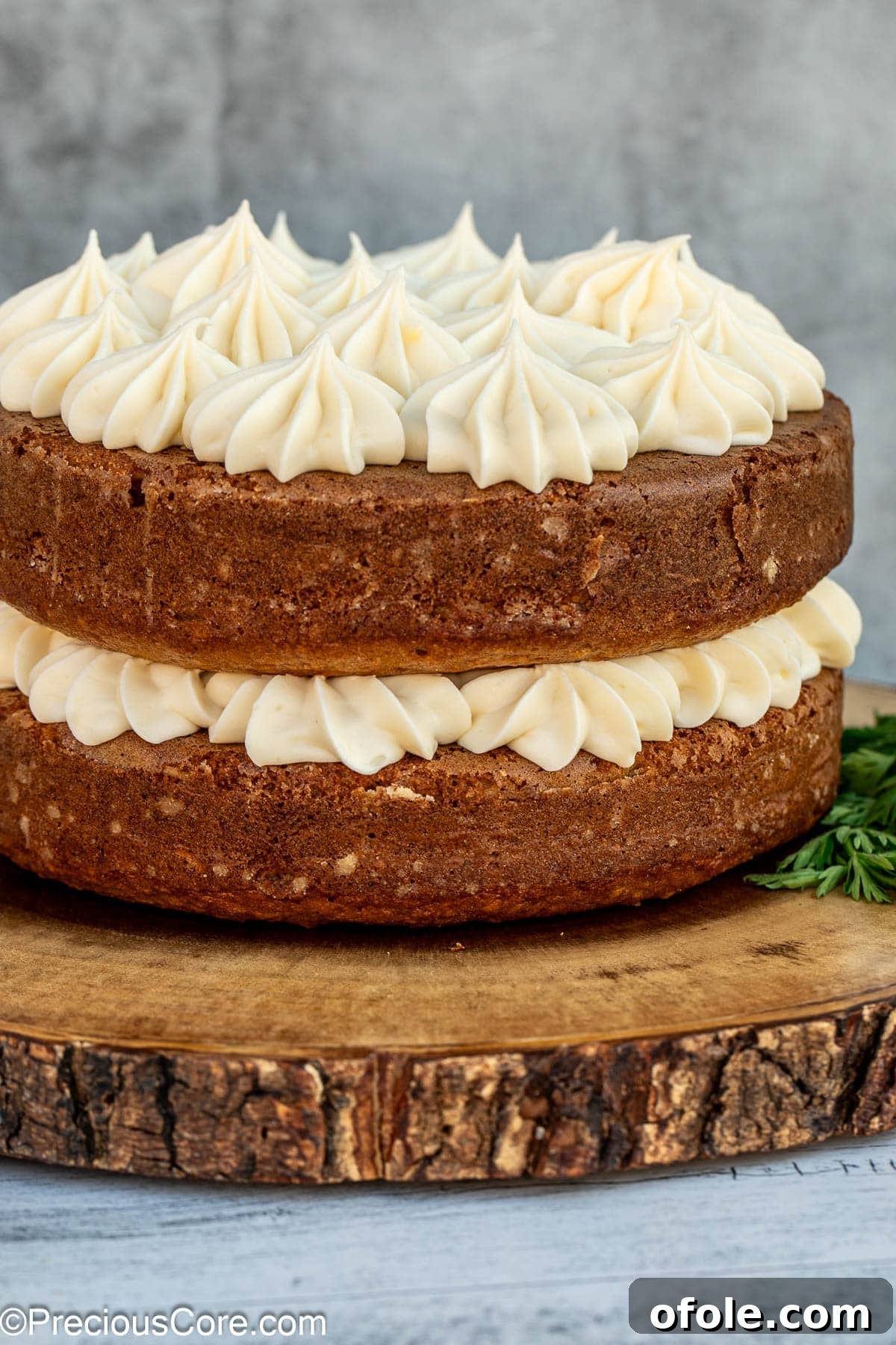 Decorated carrot cake with cream cheese frosting.