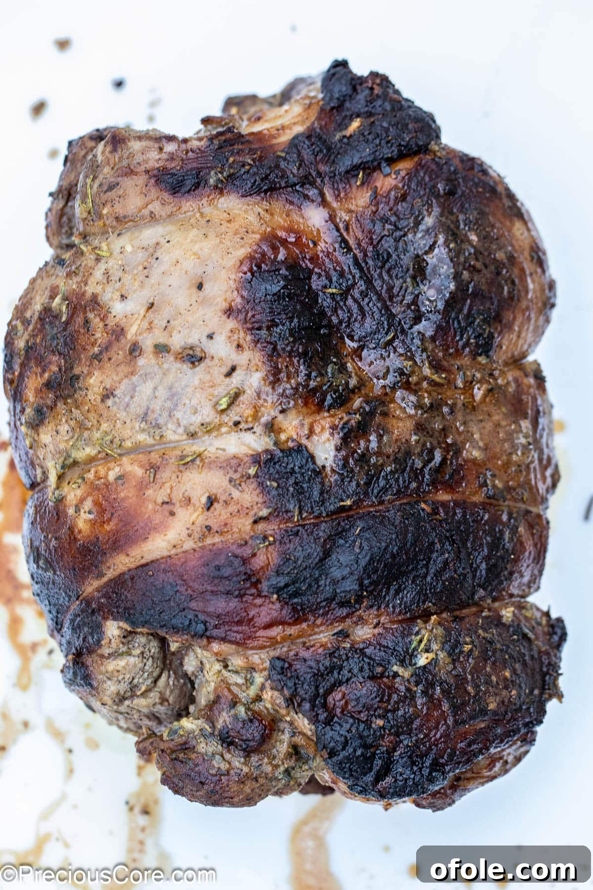 A perfectly roasted whole boneless leg of lamb, fresh out of the oven.