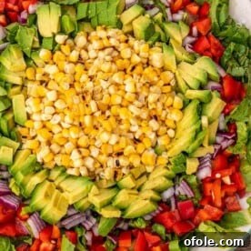 Corn, avocado and other vegetables for salad on a platter