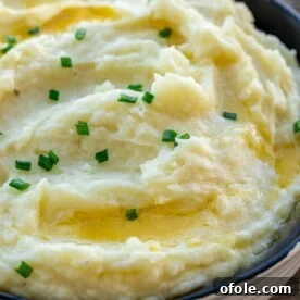 A rustic bowl filled with creamy buttermilk mashed potatoes, perfectly smooth and inviting.