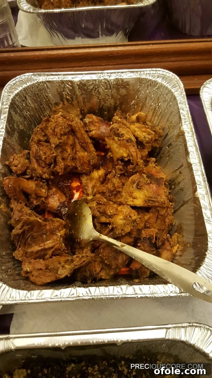 Meeting Digest 4 Khati Khati, a popular Cameroonian smoked chicken dish cooked in palm oil.