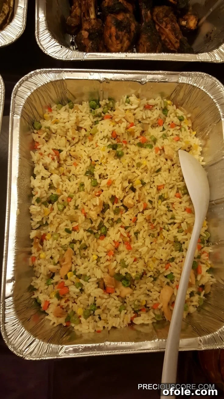 Meeting Digest 5 A large pan brimming with fragrant Coconut Fried Rice, a delightful addition to the feast.