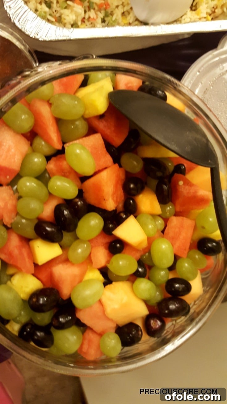 Meeting Digest 8 A vibrant, gigantic bowl of fruit salad, a thoughtful contribution from a guest.
