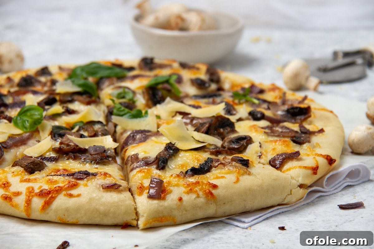 Homemade Mushroom Pizza Perfection 16 A landscape image of a beautifully baked mushroom pizza on a rustic wooden board, garnished with fresh basil leaves.