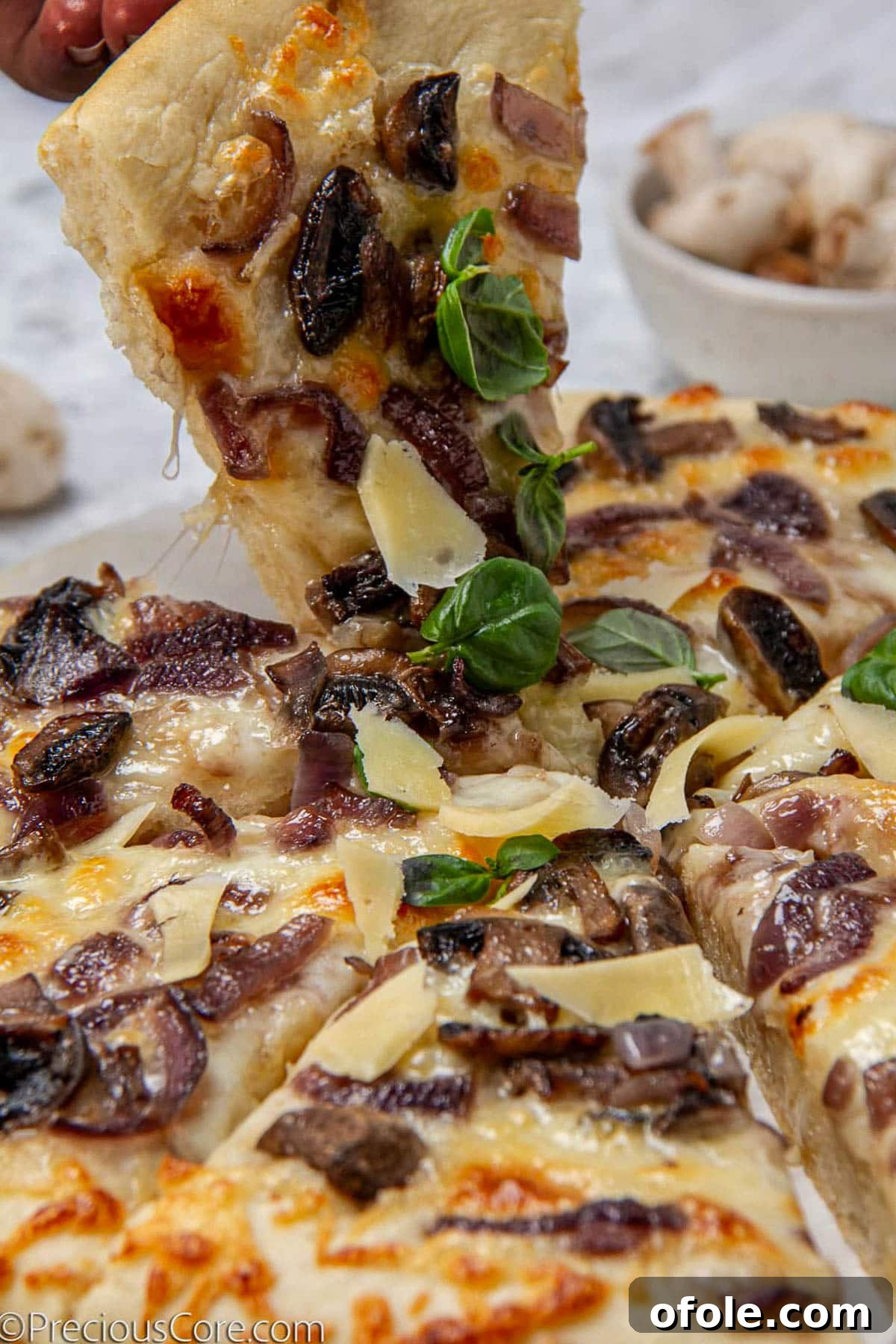 Gourmet Mushroom Pizza at Home 3 Grabbing a slice of mushroom pizza.