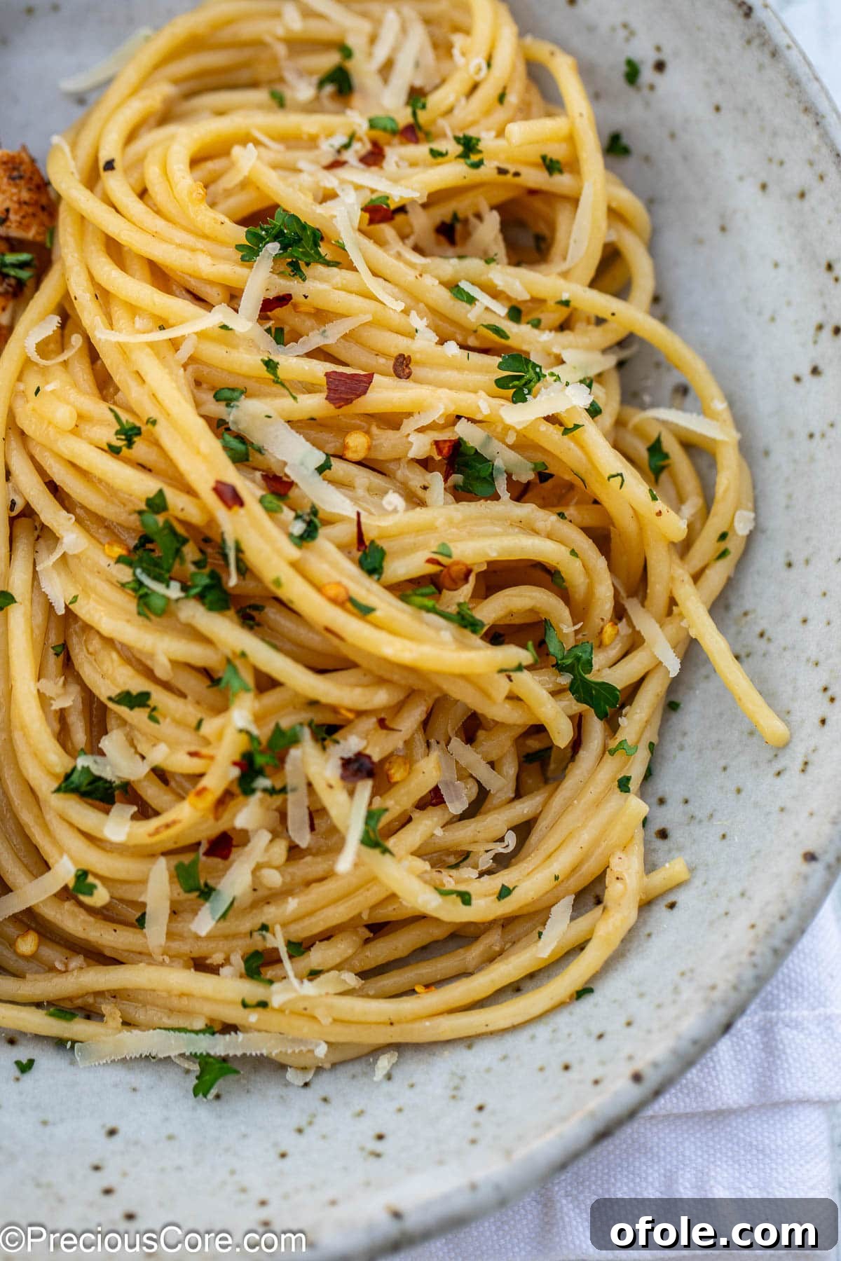A close-up shot of creamy garlic butter pasta in a white pasta bowl, ready to be enjoyed.