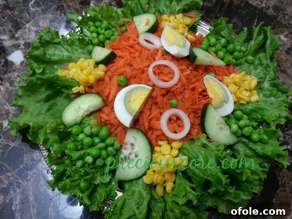 Vibrant Cameroon Salad with Authentic Dressing 14 Sweet corn, peas, and sliced egg added to the lettuce salad.