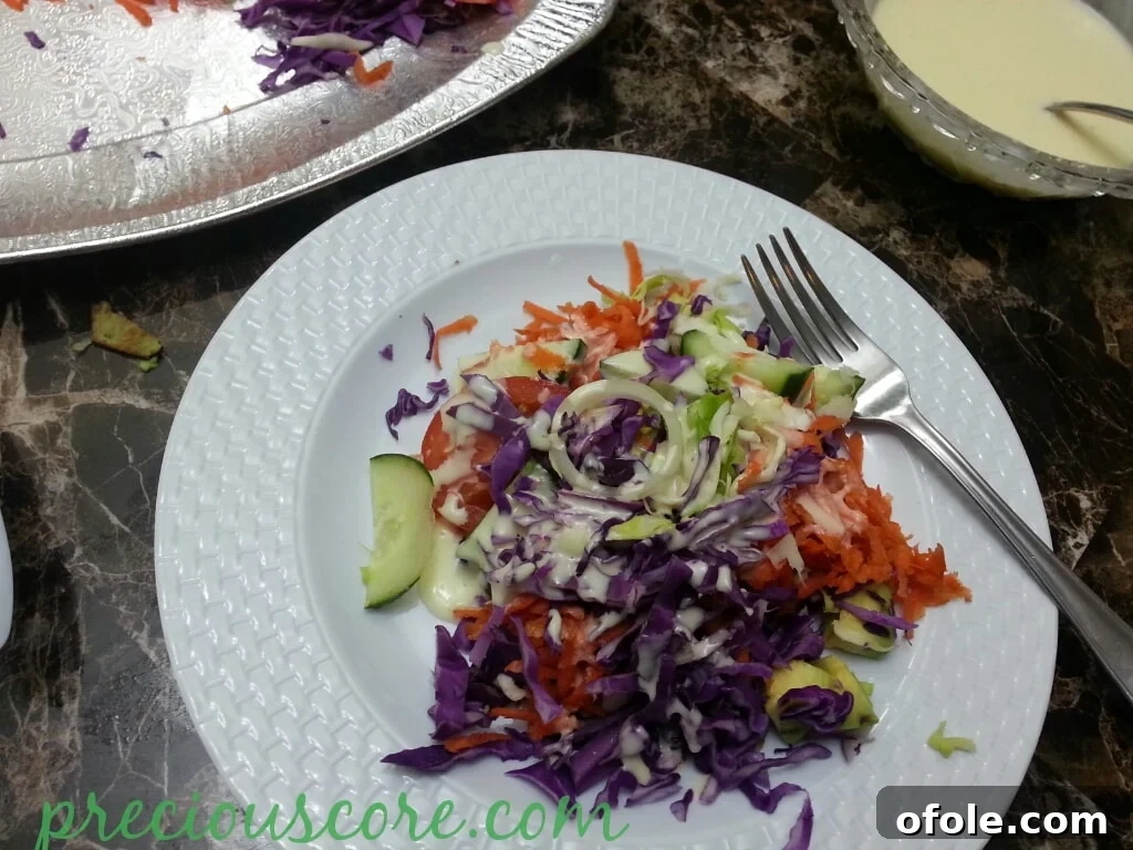 Delicious Cameroonian Salad Ready to Eat A beautifully presented, ready-to-eat Cameroonian salad with dressing.