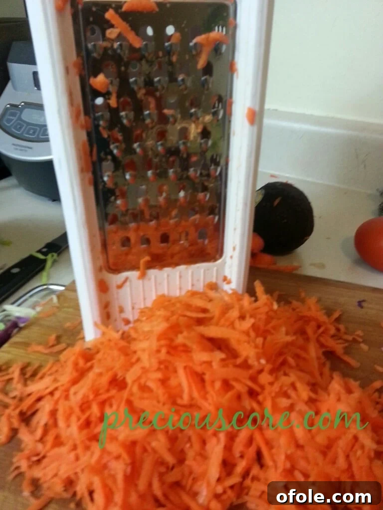 Vibrant Cameroon Salad with Authentic Dressing 5 Close-up of shredded carrots.
