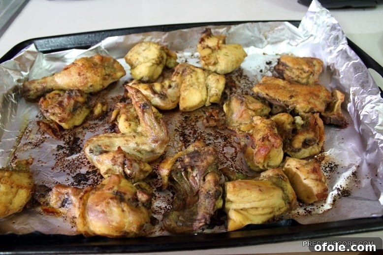 Ultimate Poulet DG Recipe 11 Oven grilled chicken in a lined baking dish.