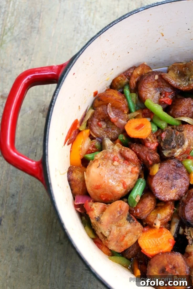 Ultimate Poulet DG Recipe 3 Poulet DG in a red Dutch oven.