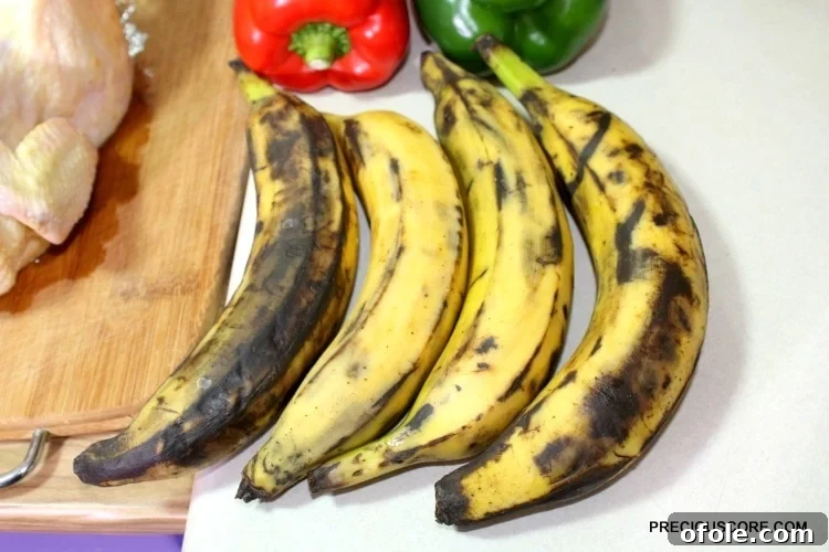 Ultimate Poulet DG Recipe 5 Brown plantains with peppers on a counter.
