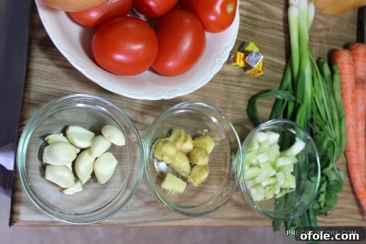 Ultimate Poulet DG Recipe 8 Bowls of ingredients including tomatoes, garlic, and ginger.