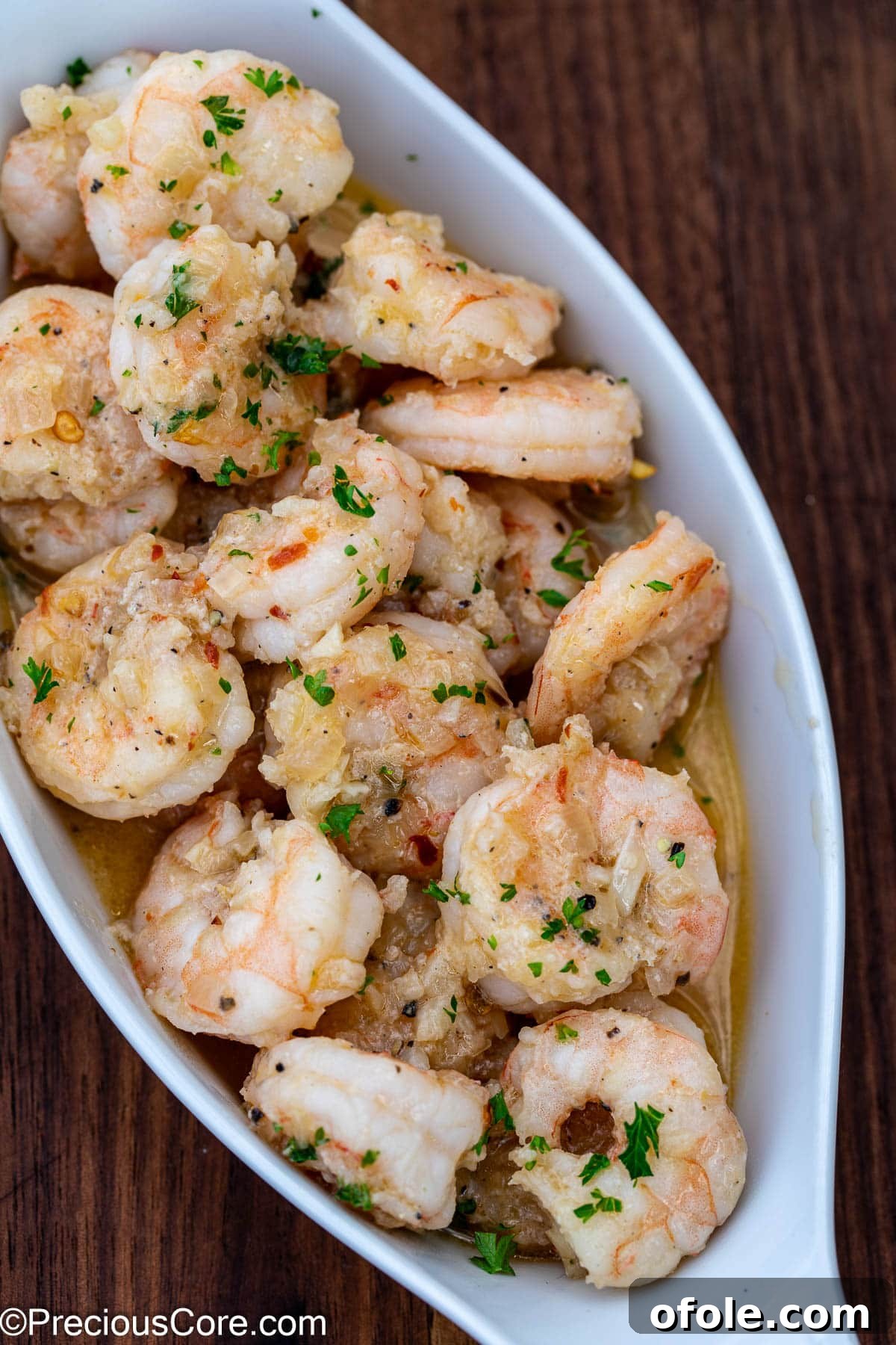 Shrimp served in a small white serving bowl.