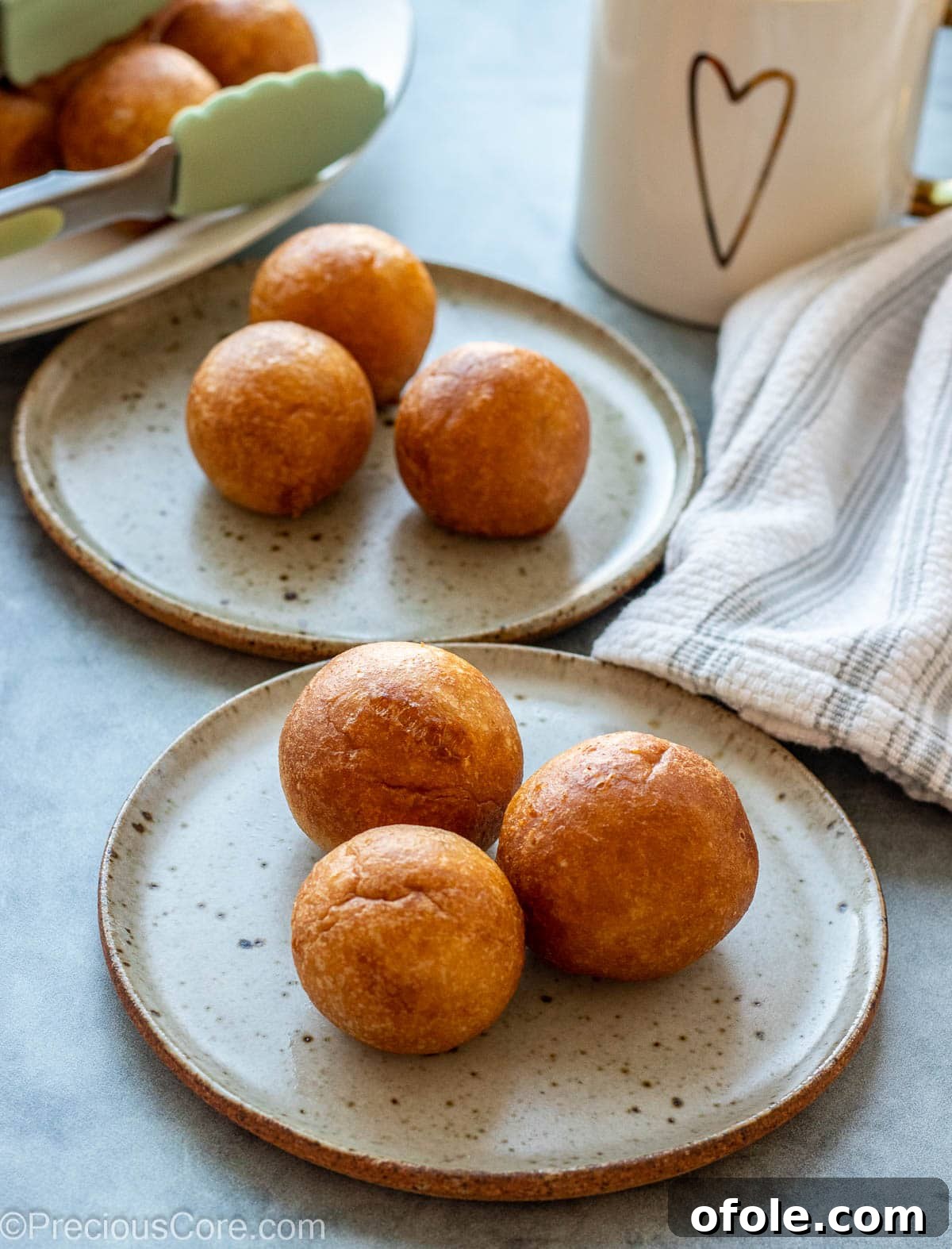 Homemade Fluffy Puff Puff 7 Two small plates featuring African snacks, highlighting the diverse culinary landscape.