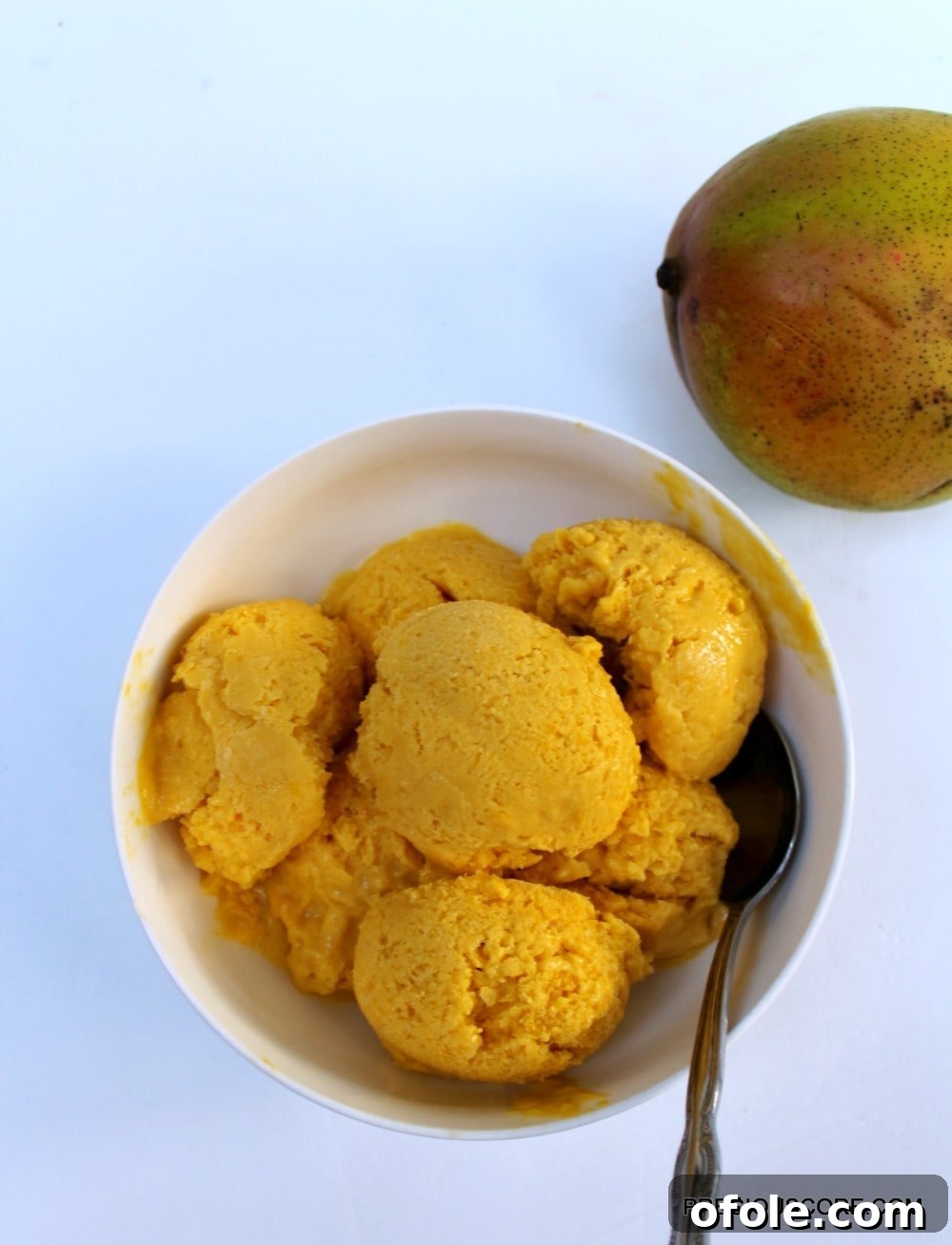 Mango Coconut Sorbet scooped into a bowl