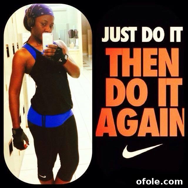 Woman working out at home with light weights