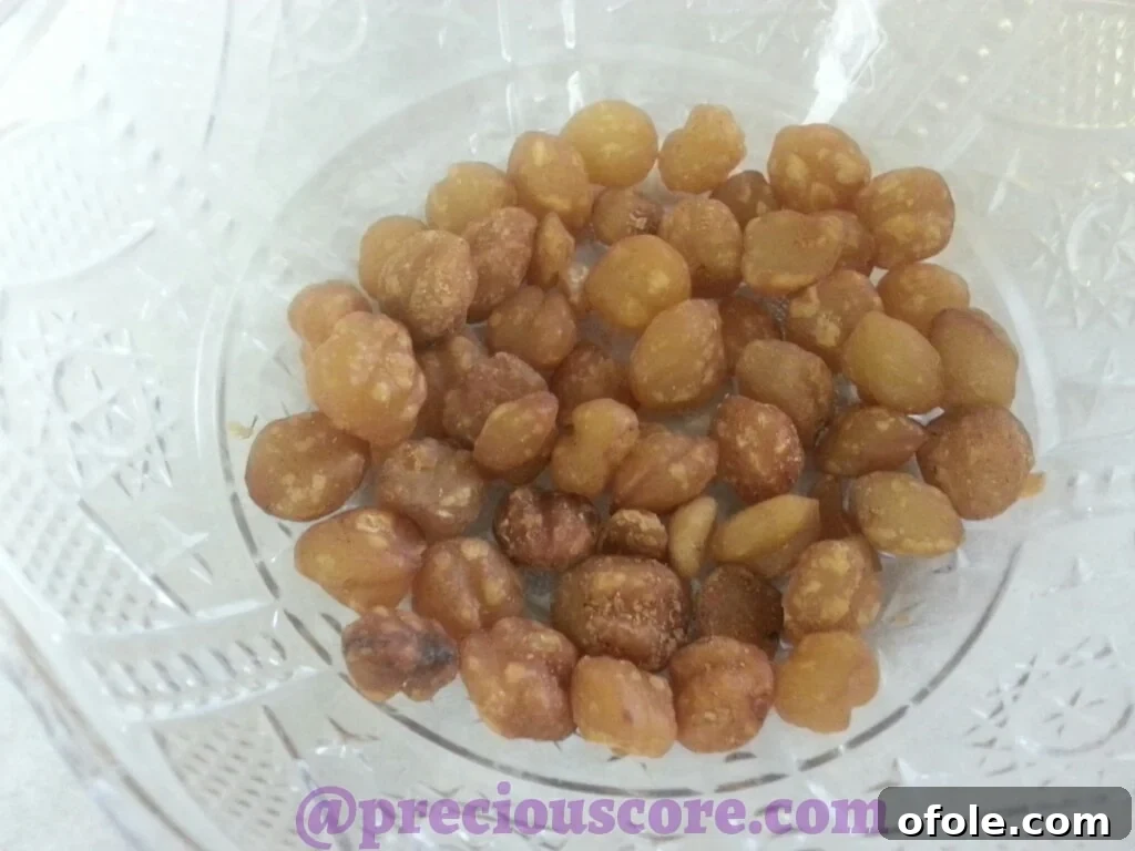 Vibrant Cameroonian Fish Pepper Soup 4 Pile of Njansa seeds, a unique African spice for pepper soup