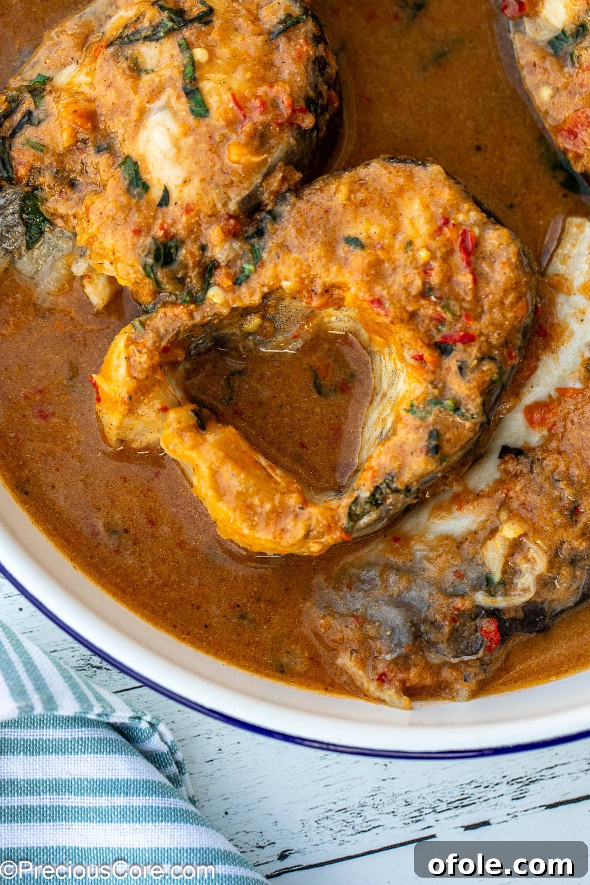 Zesty Catfish Pepperpot 3 Close-up of fish steaks in a broth.