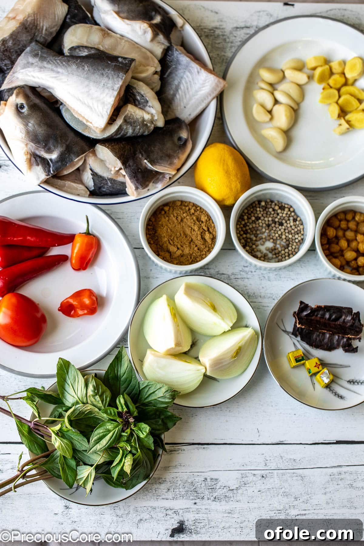 Zesty Catfish Pepperpot 4 All ingredients for catfish pepper soup on a white surface.