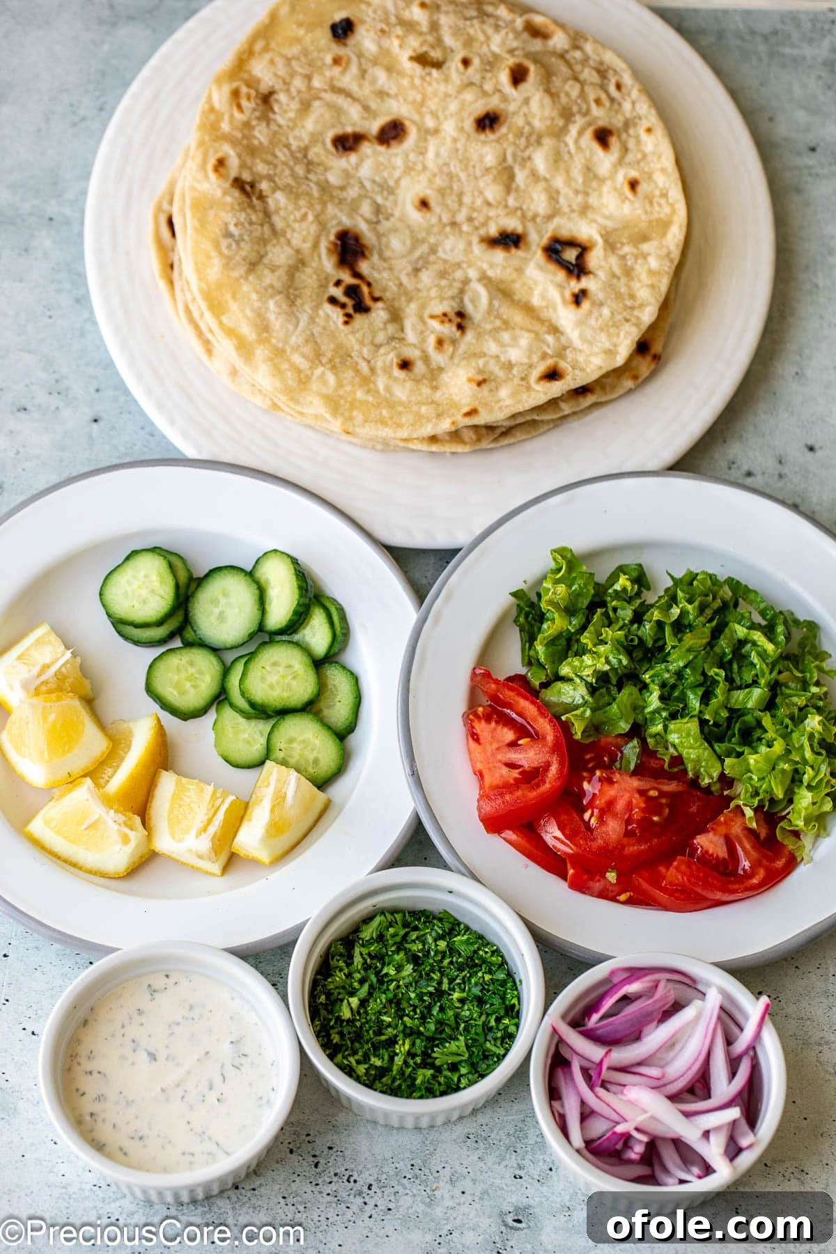 Authentic Shawarma Sauce 6 Ingredients for making a delicious shawarma wrap, including meat, vegetables, and the white sauce.